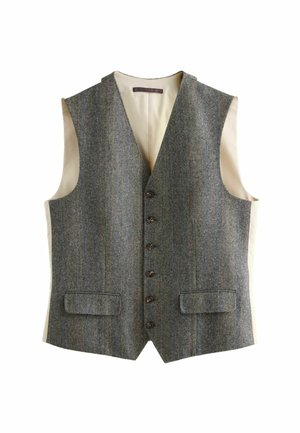 Harmaa herringbone-villaliivi, jossa on leikattu kaulus, kuusi ruskeaa nappia, kaksi etutaskua ja kerma-viimeistelty sisustus.