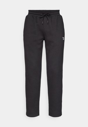 Svarta sweatpants i mjukt tyg, med elastisk midja med dragsko, smalnade ben och en liten logotyp på framsidan.