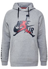 Sudadera gris hecha de una mezcla de algodón, con un gran logo de Nike Air en negro y rojo en el pecho, con un bolsillo tipo canguro y capucha con cordones.