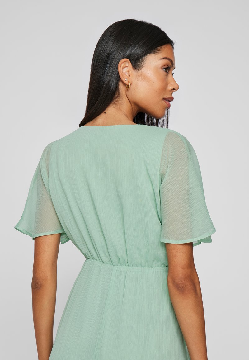 sansa stark green dress Rent Vila Petite Bridesmaid Halterneck Tulle Midi Dress With Tiered Skirt  In Mint Green main image 1