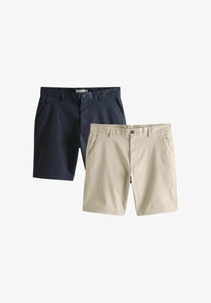 Zwei Paare lässiger Shorts, eine in Marineblau und eine in Beige, beide mit Knopfverschluss und Seitentaschen, auf weißem Hintergrund dargestellt.