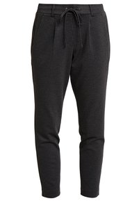 Zwart-wit geblokte broek met een drawstring taille, tapered fit en zijzakken, gemaakt van een zachte, gestructureerde stof.