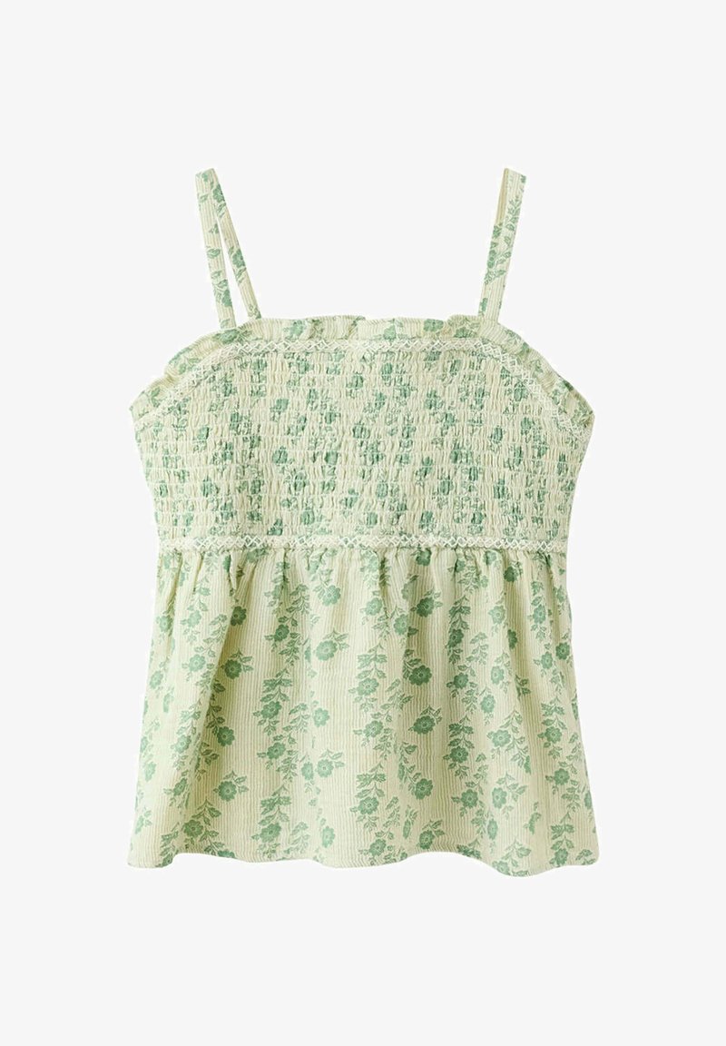 Haut sans manches jaune clair avec corsage smocké et motif floral vert, avec fines bretelles et ourlet à volants.