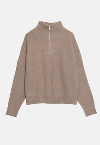 Pull en beige à col montant avec texture côtelée, fermeture éclair et larges manches. Présente une coupe décontractée et des détails cousus au niveau de l'encolure.