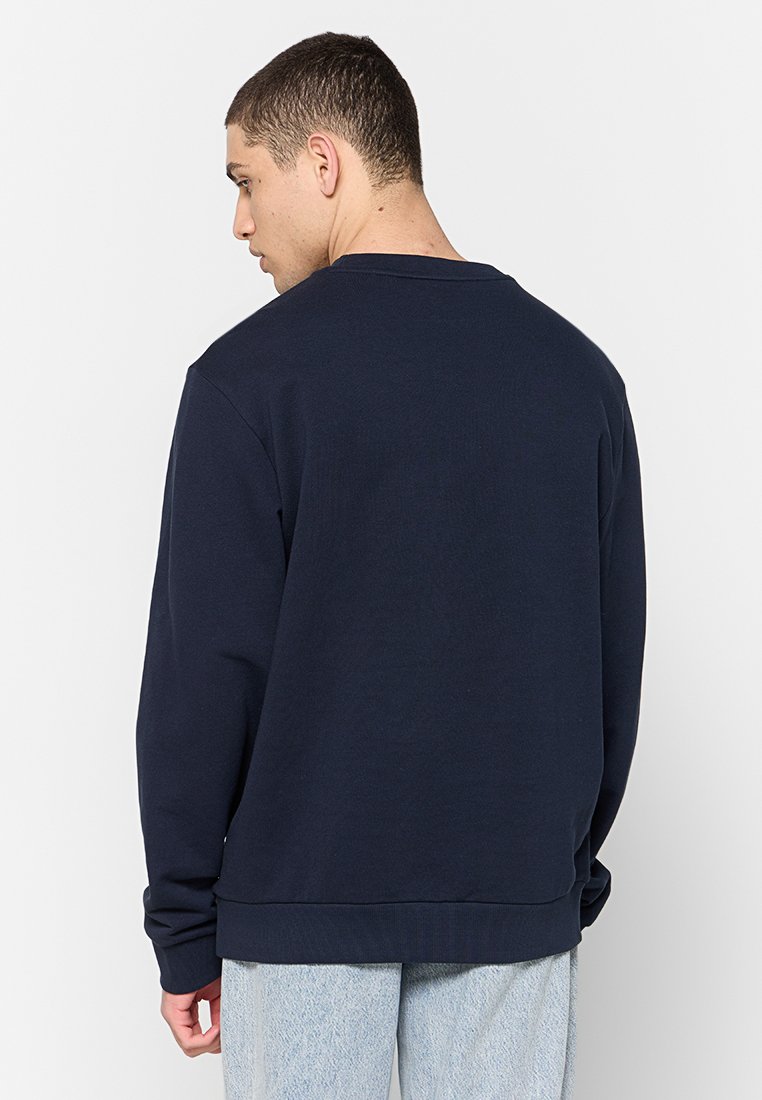 Dunkelblaue Sweatshirt mit Rundhalsausschnitt, langen Ärmeln und gerippten Bündchen. Aus weichem Stoff mit lockerer Passform und ohne sichtbare Muster gefertigt.