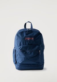 Μπλε σακίδιο πλάτης JanSport με μπροστινή τσέπη με φερμουάρ, πλαινή τσέπη από δίχτυ, επάνω χερούλι και διπλό φερμουάρ στην κύρια θήκη.