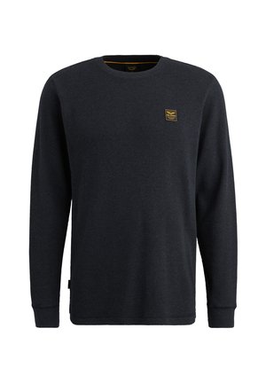 Dark blue long-sleeve ribbed sweater with a crew neck, featuring a small yellow logo patch on the chest and cuffed sleeves.