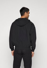 Venum ATTACK HOODIES - BLACK/WHITE - Training jacket - black/white