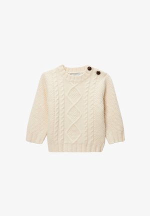 Pull en tricot couleur crème avec des motifs en nattes, un col rond et deux boutons marron sur l'épaule. Manches longues et poignets côtelés.