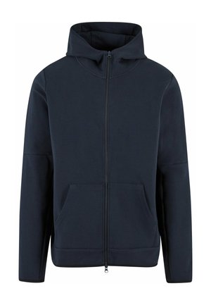 Donkerblauwe rits-hoodie van zachte stof. Heeft een hoge kraag, twee voorzakken en een subtiele elastische zoom. Minimalistisch ontwerp.