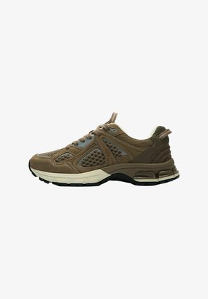 Brown mesh and suede athletic sneaker with beige cushioned sole and black tread, featuring pull tabs on tongue and heel.