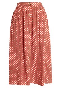 Falda midi de color óxido con lunares blancos, con un cierre frontal de botones y una cintura elástica para un diseño fruncido.