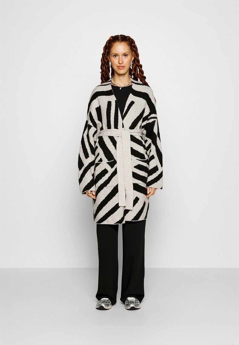 light as a breeze oversized stripe knit top | oatmeal + black main image 1