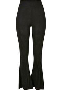 Pantalones negros de canalé con dobladillo acampanado, cintura alta y rayas verticales para añadir textura y estilo.