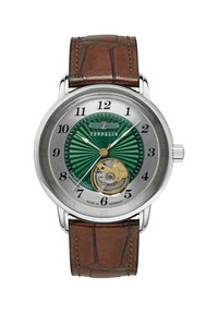Automatic watch with a green striped dial, silver case, brown leather strap, and visible movement at the bottom. Brand logo at 12 o'clock.