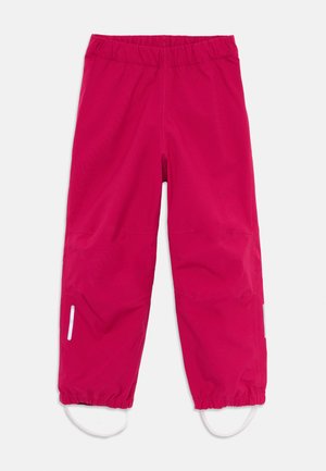 Rosa vattentäta byxor med elastisk midja, avskärmade anklar och sidoglidlåser. Har reflexdetaljer för synlighet.