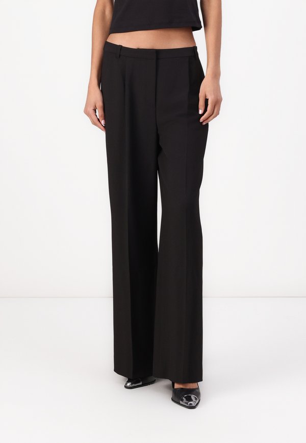 TRAVEL WIDE LEG PANT - Trousers