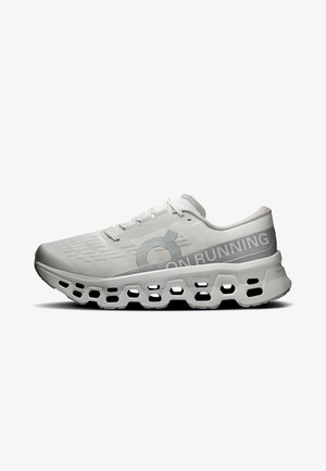 Chaussure de course gris clair avec semelle perforée, design à lacets et marquage "ON RUNNING" sur le côté.