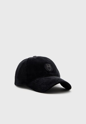 Schwarze Cord-Baseballkappe mit gebogenem Schirm und kleinem rundem Aufnäher mit einfachem Eulengrafik auf dem Vorderteil.