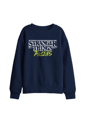 Marineblaue Sweatshirt mit weißem und neongrünem „Stranger Things Tales from 85“-Schriftzug vorne, mit langen Ärmeln und gerippten Bündchen und Saum.