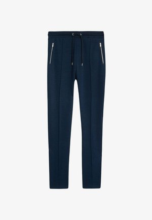 Granatowe spodnie dresowe z miękkiego materiału, z elastycznym pasem ze sznurkiem, dwiema kieszeniami na zamek i zwężającym się krojem nogawek.