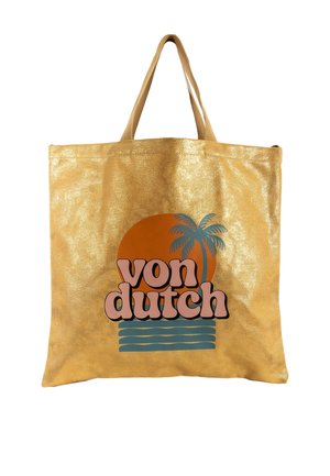 Bolsa tote reutilizable dorada con asas cortas, con gráfico de puesta de sol, palmera, olas y texto "von dutch" en el frente.