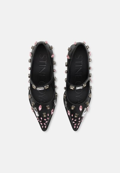 Black pointed-toe flats with jeweled embellishments in pink and clear colors. Smooth material with a polished finish. Branding visible inside.