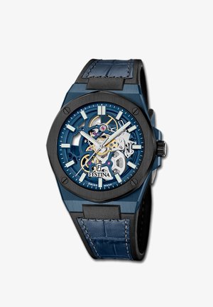 Blue and black wristwatch with skeleton dial showing mechanical gears, luminescent hour markers, silver hands, and leather-textured strap.