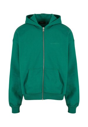 Grøn zip-up hoodie med en rummelig lomme foran, ribbede manchetter og kant, lavet af blødt stof. Har et diskret logo på brystet.