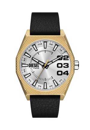 Hexagonal watch with a silver dial, gold textured bezel, black hour markers, and black leather strap. Features bold numbers at 2, 3, and 4.