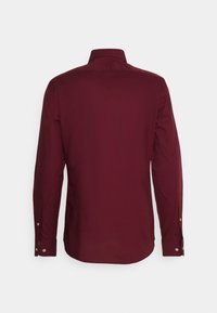 Tommy Hilfiger Tailored SOLID SHIRT - Camisa formal - deep rouge