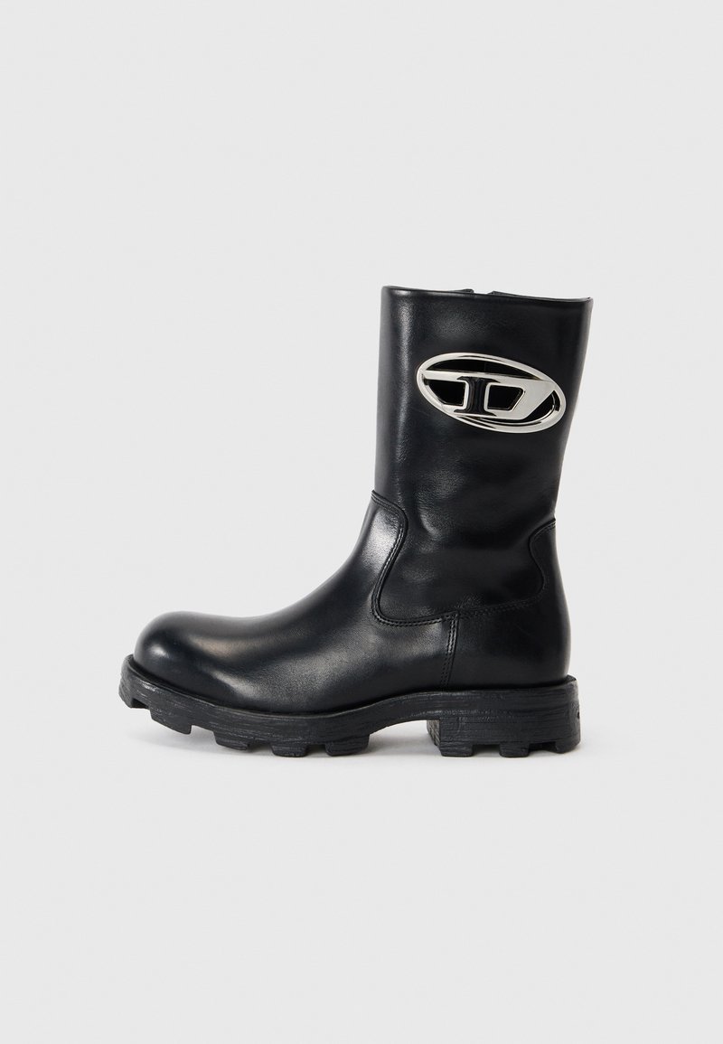 Black leather ankle boot with a round toe and rubber sole. Side logo detail in silver, smooth texture, and mid-calf height.