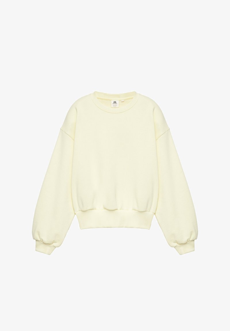 Sweat-shirt à manches longues couleur crème avec poignets, ourlet et encolure ronde côtelés, isolé sur fond blanc.