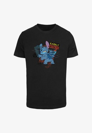 T-shirt in cotone nero con un personaggio dei cartoni animati blu, testo "EASILY DISTRACTED" e dettagli grafici colorati. Maniche corte, vestibilità standard.
