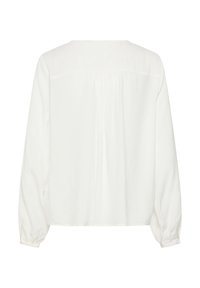 Blouse blanche à manches longues, coupe ample, détail froncé au dos et poignets boutonnés.