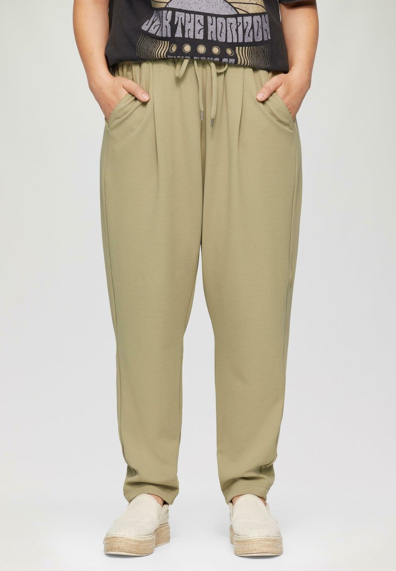 Olijfgroene sweatpants met een relaxte pasvorm, een elastische tailleband en een trekkoord. Heeft zijzakken en een gladde textuur. Casual ontwerp.