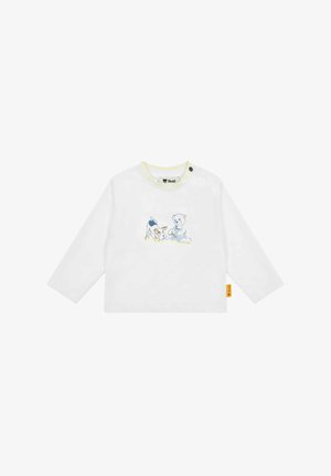 Camicia bianca a maniche lunghe con scollatura gialla, caratterizzata da una grafica blu e beige di un cane e un orsacchiotto. Include un'etichetta laterale.