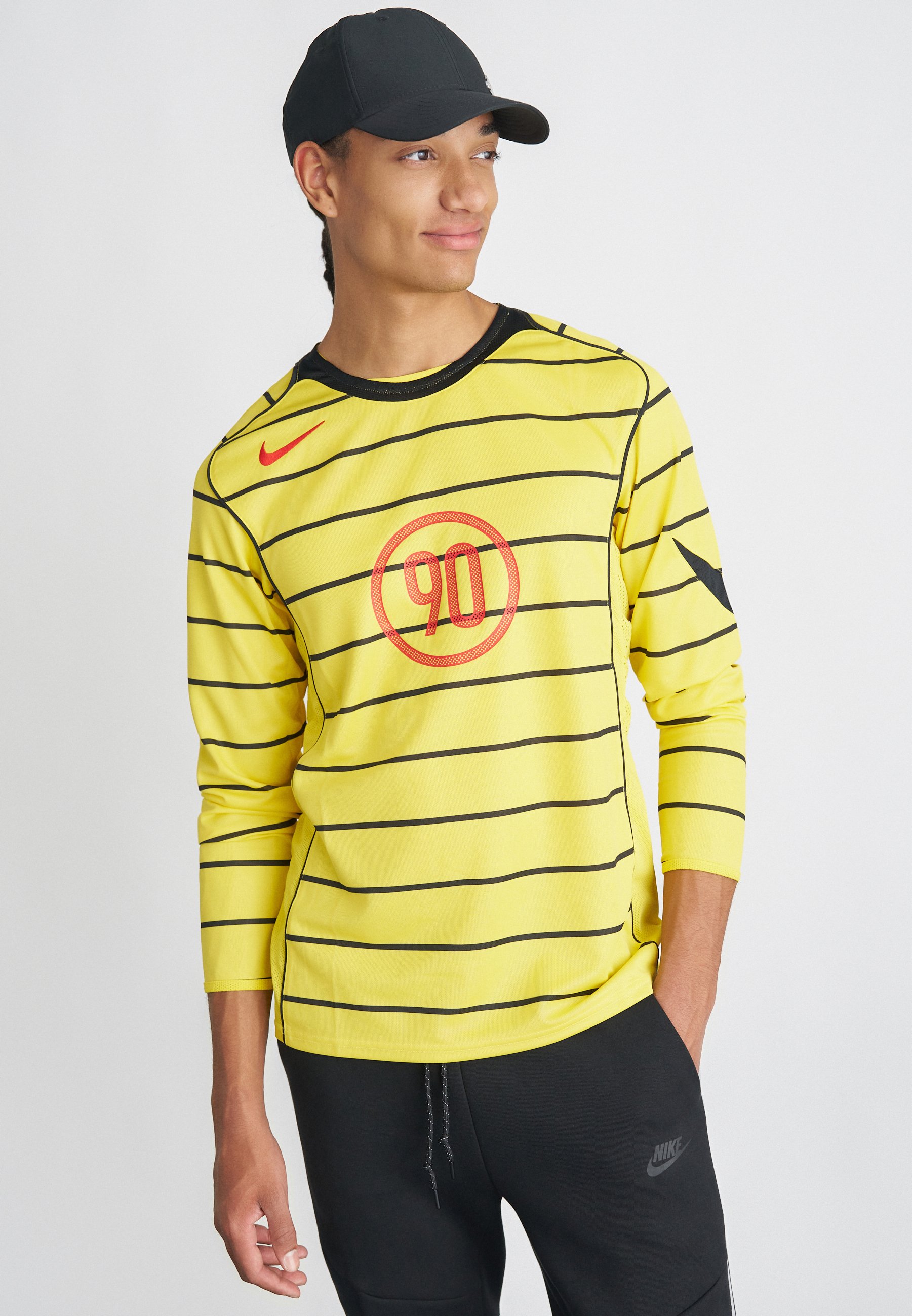 red yellow nike shirt
