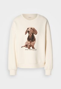 Cremefarvet sweatshirt med et detaljeret print af en dachshund og teksten "STAY PAWSITIVE", med ribbede cuffs og kant.