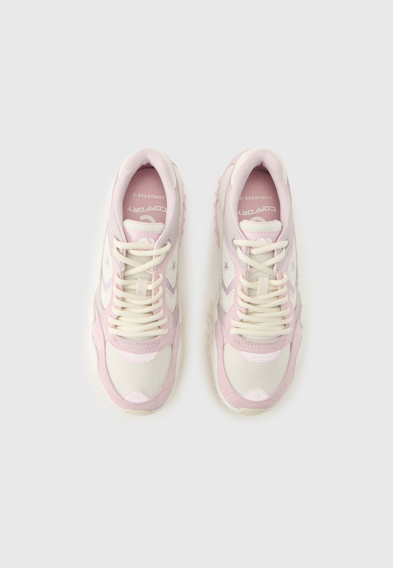Pair of light pink and white sneakers with white laces, mesh and suede materials, viewed from above on a neutral background.