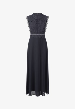 Lungo abito nero con corpetto in pizzo e spalline ondulate, colletto alto e gonna fluida. Chiusura sul retro con cerniera per una facile indossabilità.