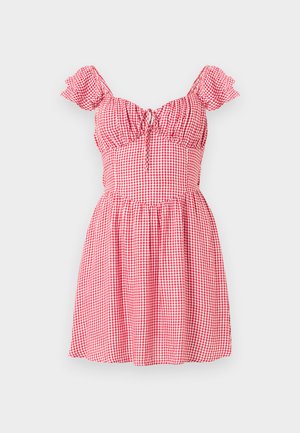 Sarkans un balts pārbaudes raksta īss kleita ar puff piedurknēm, bārkstainu bodi un aukliņu detaļu priekšpusē. Izplūdušas svārku dizains.