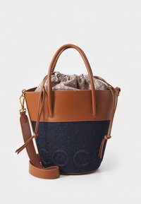 Brown leather and blue denim bucket bag with a drawstring closure, featuring a patterned lining and adjustable shoulder strap.