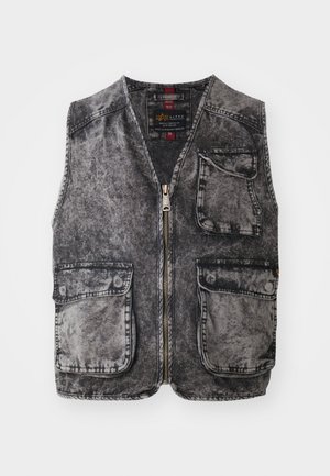 Denim vest in a faded black color, featuring a zip closure, five pockets, and a sleeveless design. Textured fabric with visible stitching.