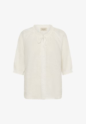 Bluza crem cu mâneci trei sferturi, decolteu cu volane și un detaliu cu fundă în față, cu broderie verticală.