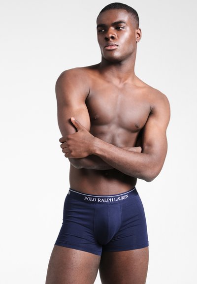 Marineblauwe boxershorts met een witte "POLO RALPH LAUREN" tailleband, rekbare stof, aansluitend ontwerp, geschikt als hereninlegkleding.