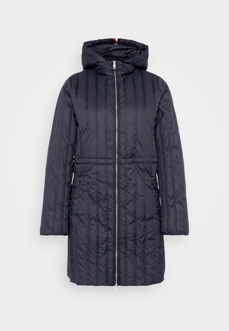 Padded navy coat with a hood, featuring a full zipper, ribbed texture, and side pockets. Mid-length design with a fitted waist.