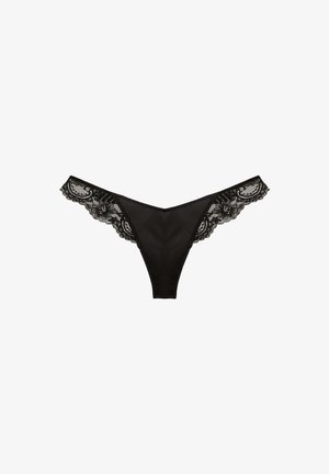 Black lace thong with a smooth fabric body and detailed lace trim along the waistband, featuring floral patterns and scalloped edges.