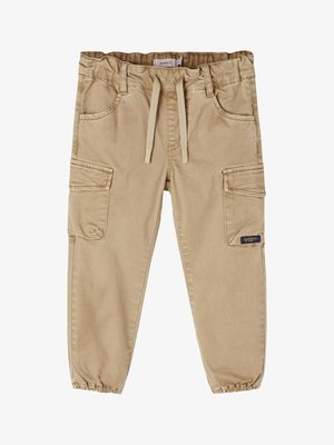 Beige cargo bukser med elastisk talje og snøring, med sidelommer og elastiske manchetter ved anklerne. Glat bomuldsstof.