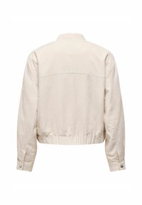 Lichtbeige cropped jack met een kraaghalslijn, lange mouwen en een elastische taille. Gemaakt van een textuurstof met minimale stikdetails.